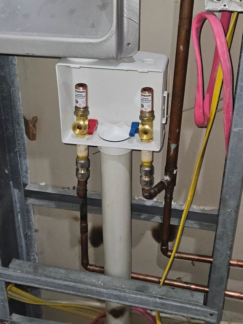 Washing machine outlet box with hammer arrestor valves on copper lines
